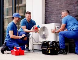 HVAC technicians discussing an outdoor mini-split installation